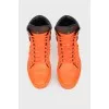 Orange leather sneakers are high