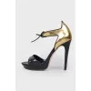 Sandals with a closed golden heel