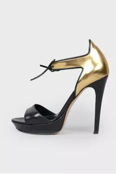 Sandals with a closed golden heel