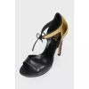 Sandals with a closed golden heel