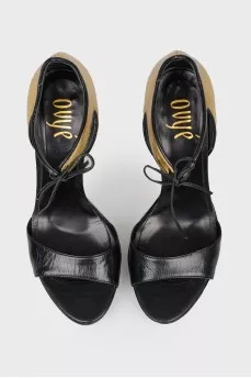 Sandals with a closed golden heel