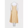 Fitted dress with a full skirt with a tag