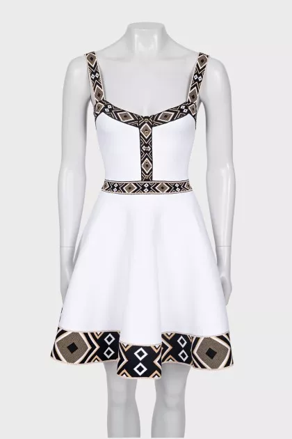 White dress with geometric pattern
