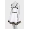 White dress with geometric pattern