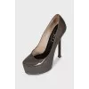 Patent leather shoes with suede heels