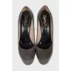 Patent leather shoes with suede heels