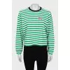 Long sleeve striped shirt decorated with a patch