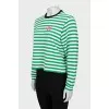 Long sleeve striped shirt decorated with a patch