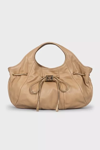 Bag decorated with a golden bow