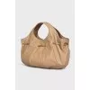 Bag decorated with a golden bow
