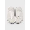 White leather flip flops with tag