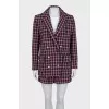 Suit consisting of a jacket with pockets and shorts
