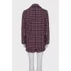 Suit consisting of a jacket with pockets and shorts