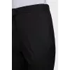 Black trousers with arrows and tag