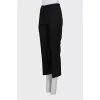 Black trousers with arrows and tag