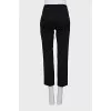 Black trousers with arrows and tag