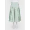Green skirt in a fold