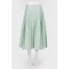 Green skirt in a fold