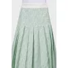 Green skirt in a fold
