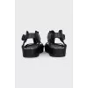 Leather sandals with metal decor