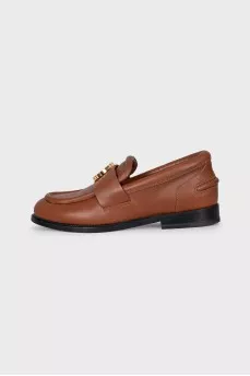 Brown loafers with gold decor