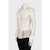 Silk blouse with buttons decorated with frills