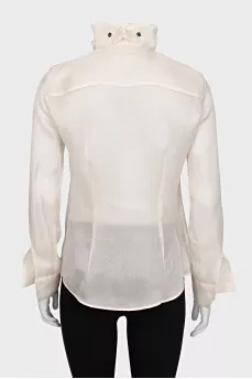 Silk blouse with buttons decorated with frills