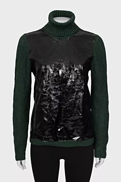 Green sweater with patent leather element