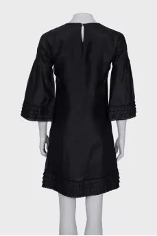 Straight cut dress decorated with frills