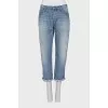 Cropped jeans with distressed buttons