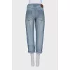 Cropped jeans with distressed buttons