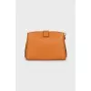 Orange leather bag with tag