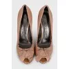 Patent leather shoes decorated with frills