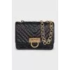 Leather bag on a gold chain