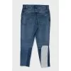 Mid-rise distressed jeans