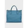 Leather bag with embossed logo