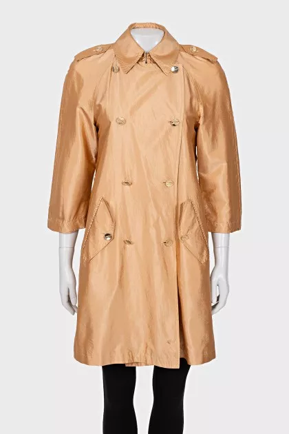 Double-breasted orange raincoat