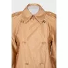 Double-breasted orange raincoat