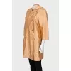 Double-breasted orange raincoat