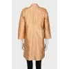 Double-breasted orange raincoat
