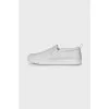 Leather slip-ons with logo