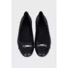 Black ballet flats with silver hardware