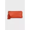 Orange leather clutch