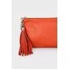 Orange leather clutch