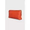 Orange leather clutch