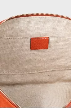 Orange leather clutch