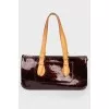 Bag from varnish leather in a corporate print
