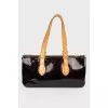 Bag from varnish leather in a corporate print