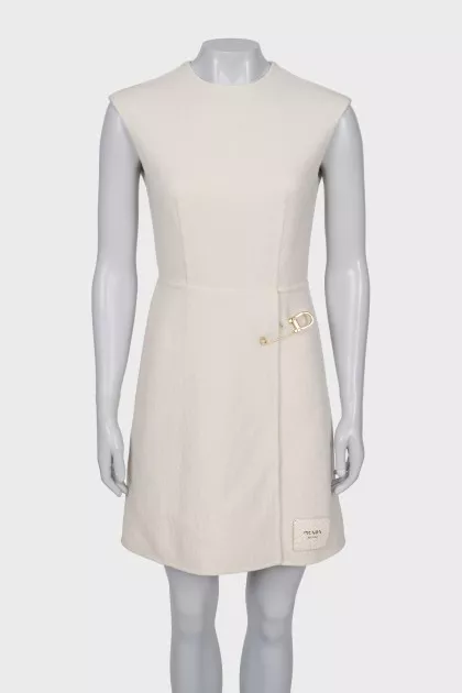 White dress with golden pin