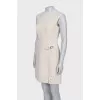 White dress with golden pin